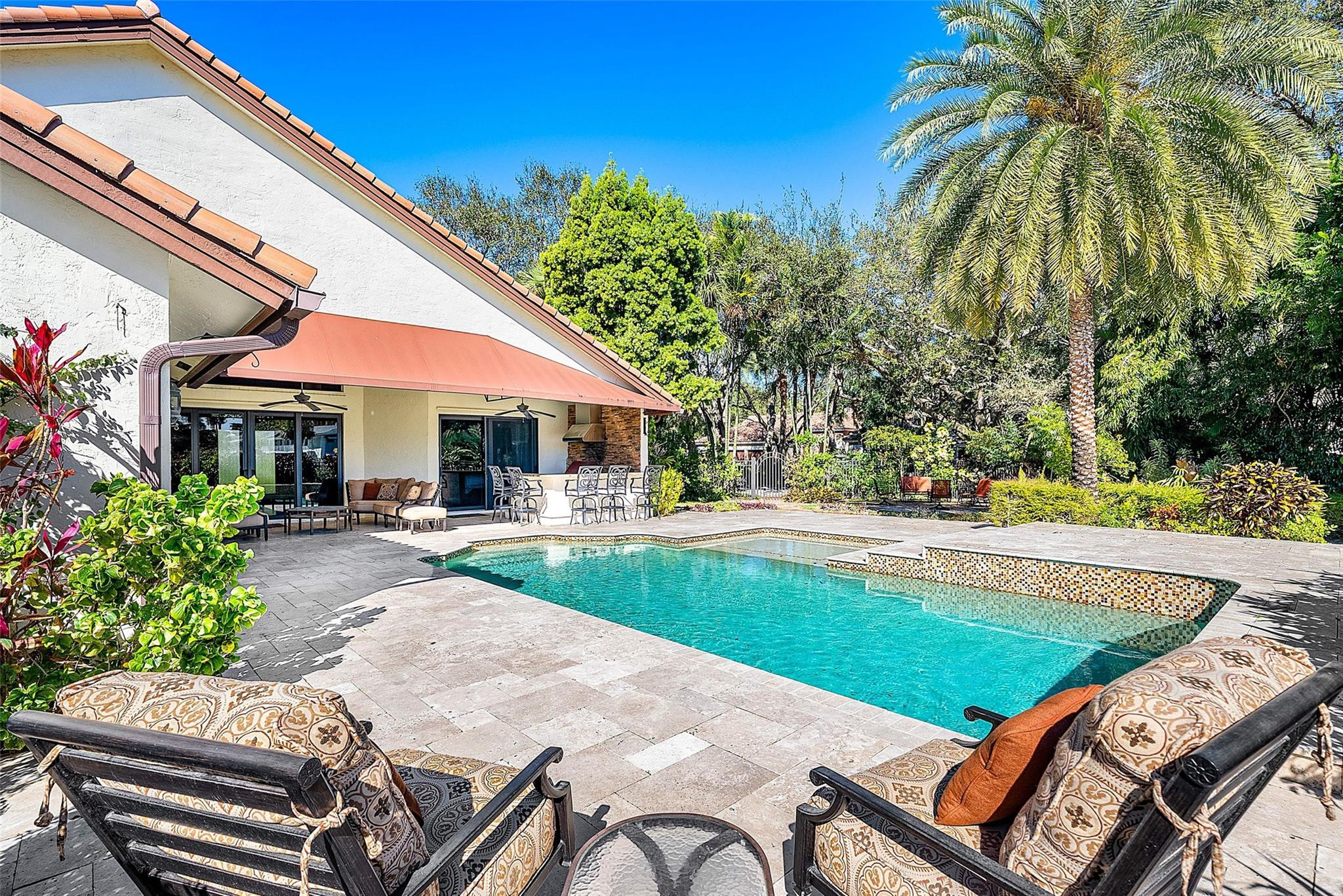 2455 Hampton Bridge Road Delray Beach, FL 33445 - Photo 27 of 46 a view of a swimming pool with chair and tables