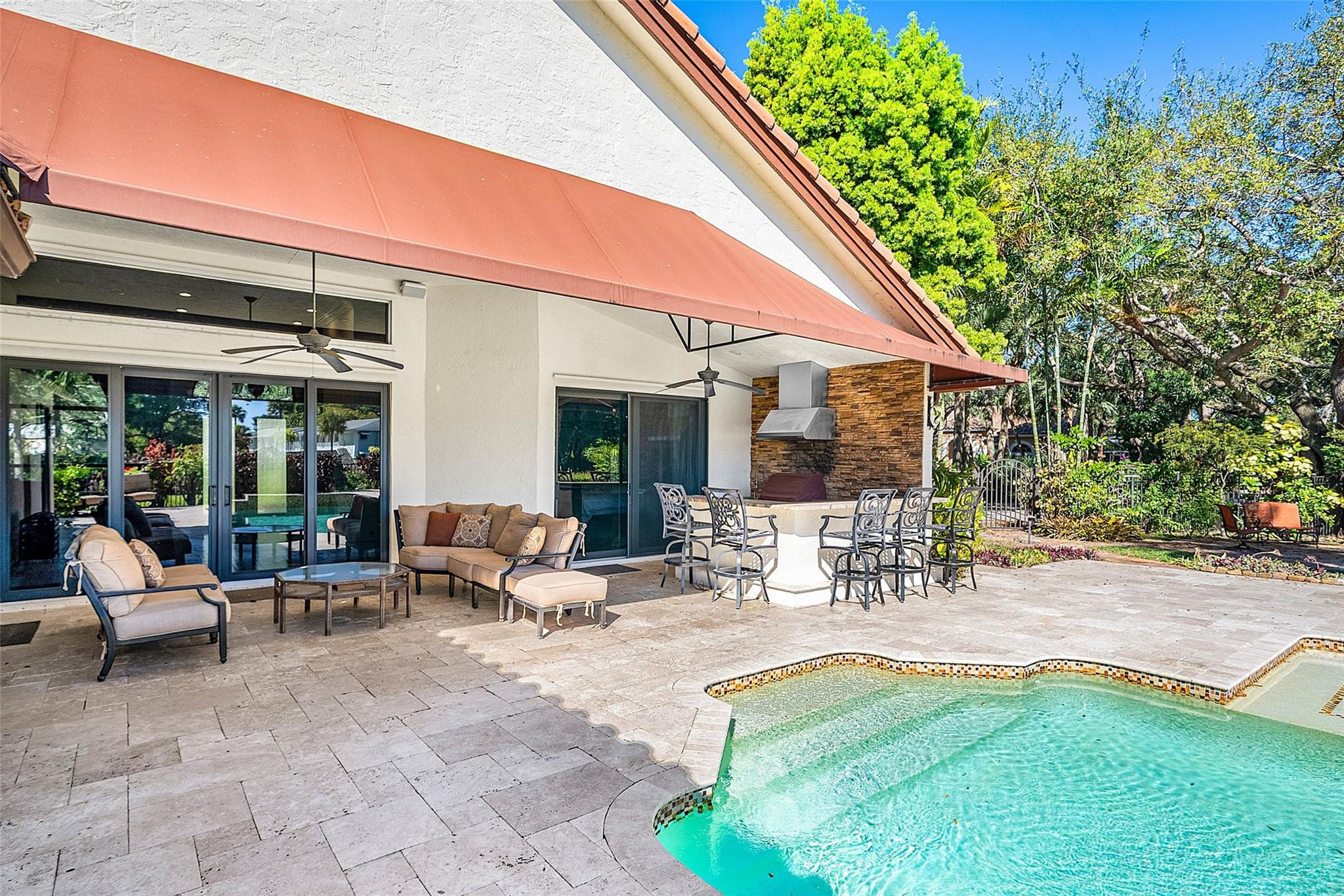 2455 Hampton Bridge Road Delray Beach, FL 33445 - Photo 28 of 46 a building outdoor space with patio furniture and garden