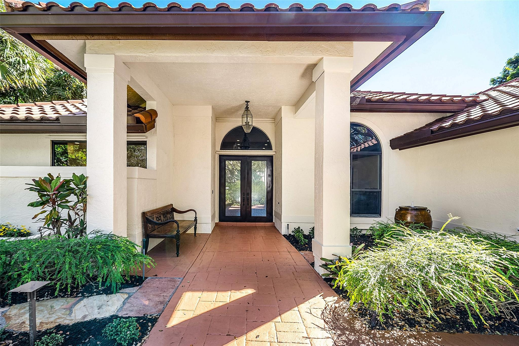 2455 Hampton Bridge Road Delray Beach, FL 33445 - Photo 3 of 46 a front view of a house with a yard