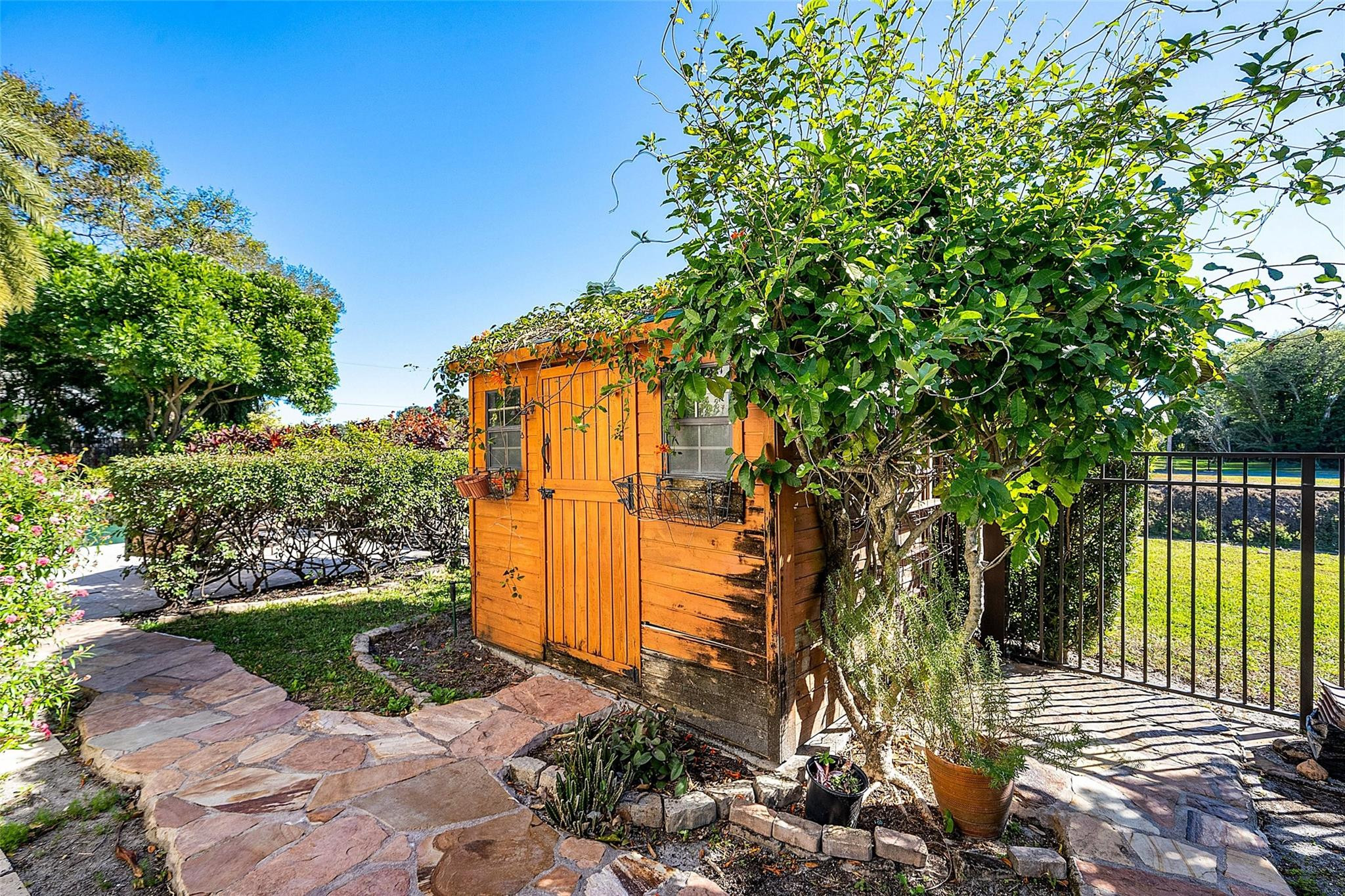 2455 Hampton Bridge Road Delray Beach, FL 33445 - Photo 35 of 46 a front view of a house with a yard