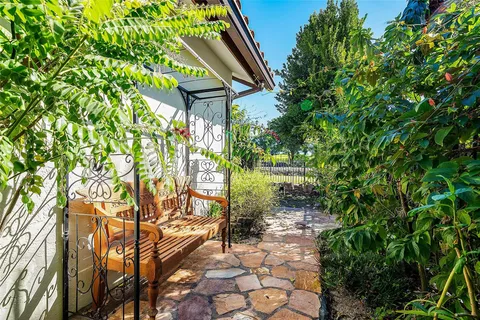 a backyard of a house with lots of green space