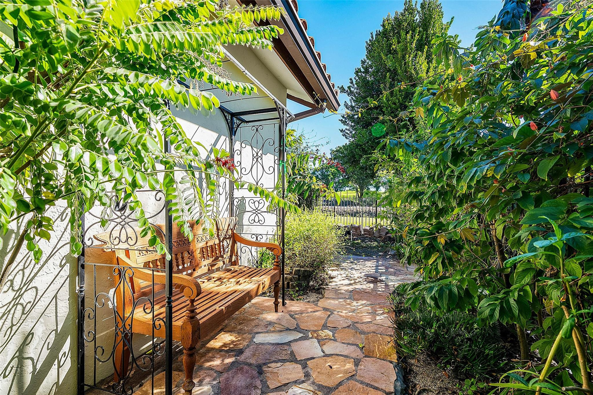 2455 Hampton Bridge Road Delray Beach, FL 33445 - Photo 36 of 46 a backyard of a house with lots of green space
