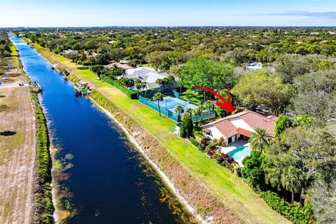 a view of a yard with an outdoor seating