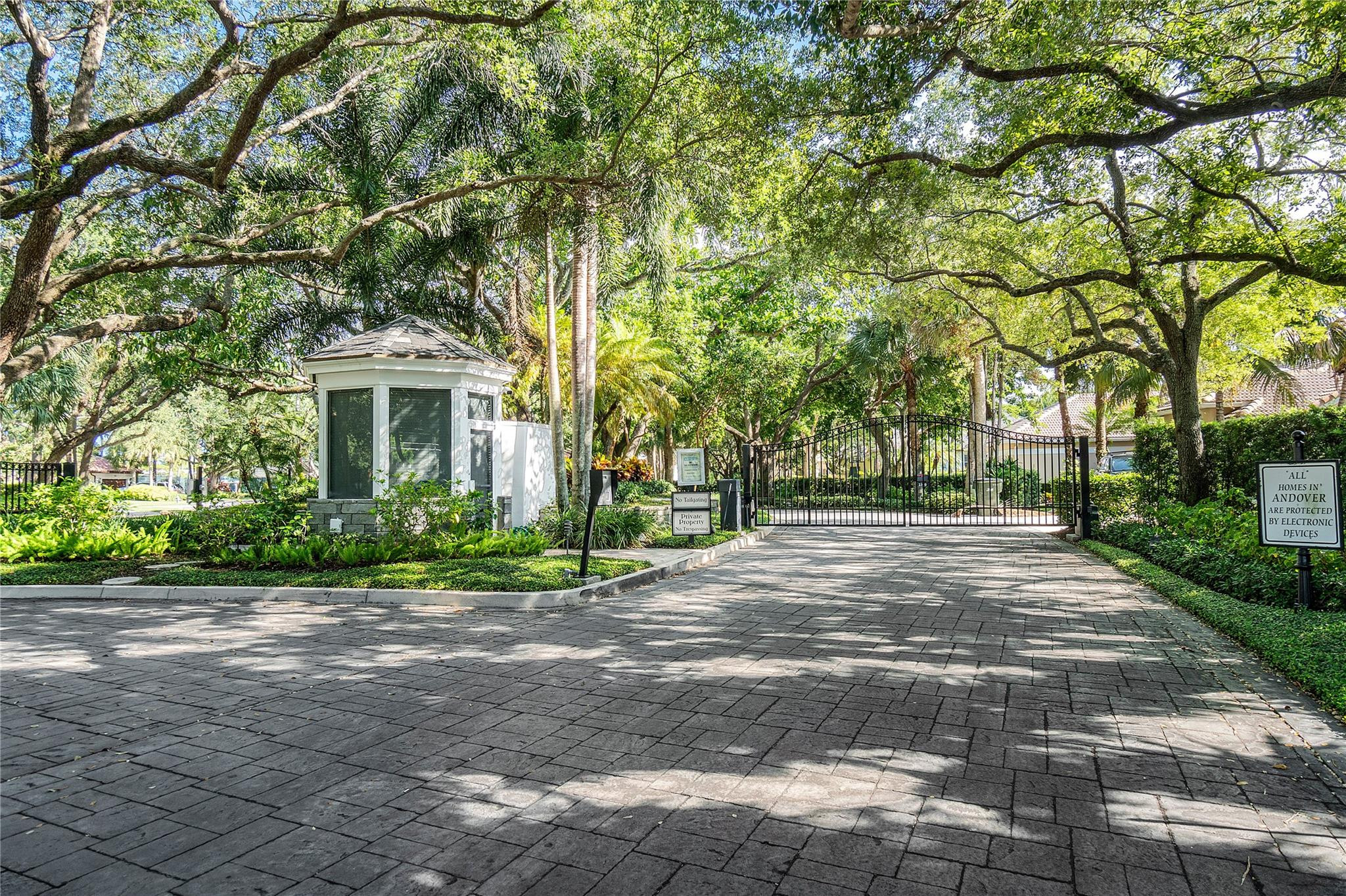 2455 Hampton Bridge Road Delray Beach, FL 33445 - Photo 44 of 46 a front view of a house with a yard and a trees