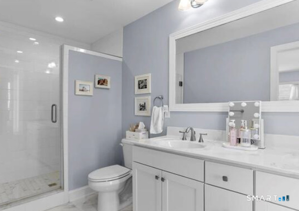 930 Reef Road Fairfield, CT 06824 - Photo 11 of 15 a bathroom with a toilet sink and shower