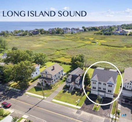 930 Reef Road Fairfield, CT 06824 - Photo 14 of 15 a view of swimming pool with seating area and car parked