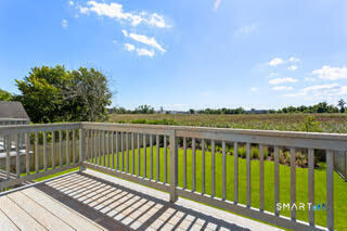 930 Reef Road Fairfield, CT 06824 - Photo 3 of 15 a view of a wooden roof deck