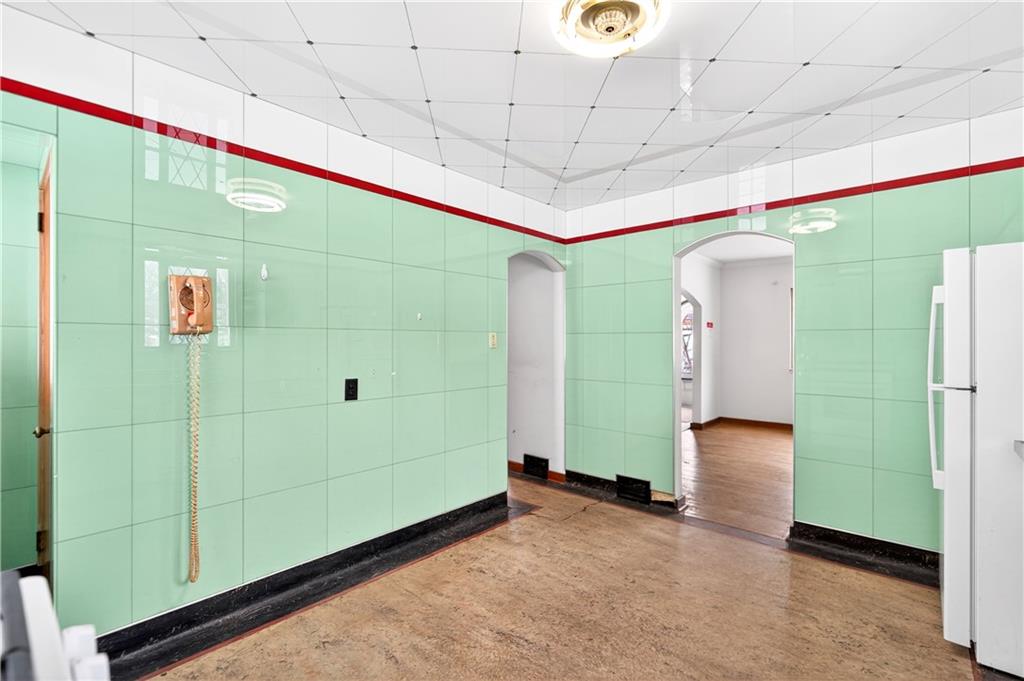 746 McNeilly Road Pittsburgh, PA 15226 - Photo 16 of 47 a bathroom with a mirror and a shower