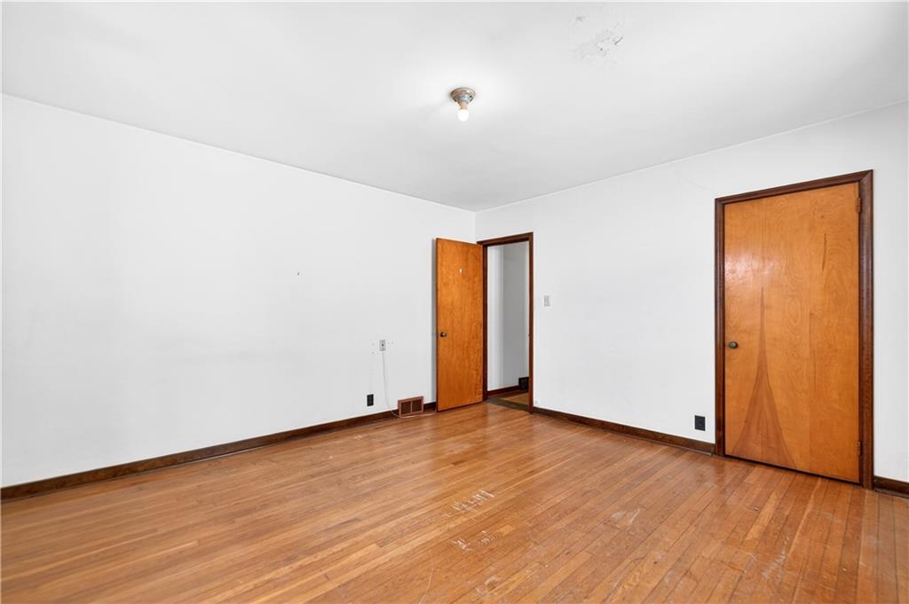 746 McNeilly Road Pittsburgh, PA 15226 - Photo 19 of 47 an empty room with wooden floor and windows
