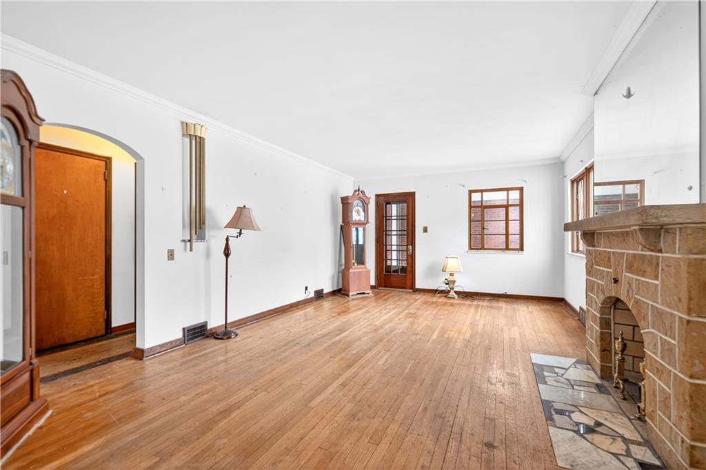 746 McNeilly Road Pittsburgh, PA 15226 - Photo 7 of 47 a view of a livingroom with wooden floor and windows