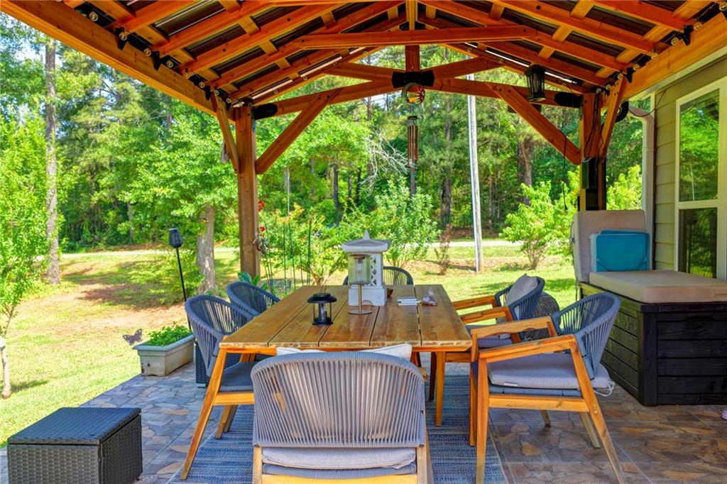 204 Lynn Road Bethlehem, GA 30620 - Photo 43 of 44 a view of an outdoor sitting area with furniture and backyard