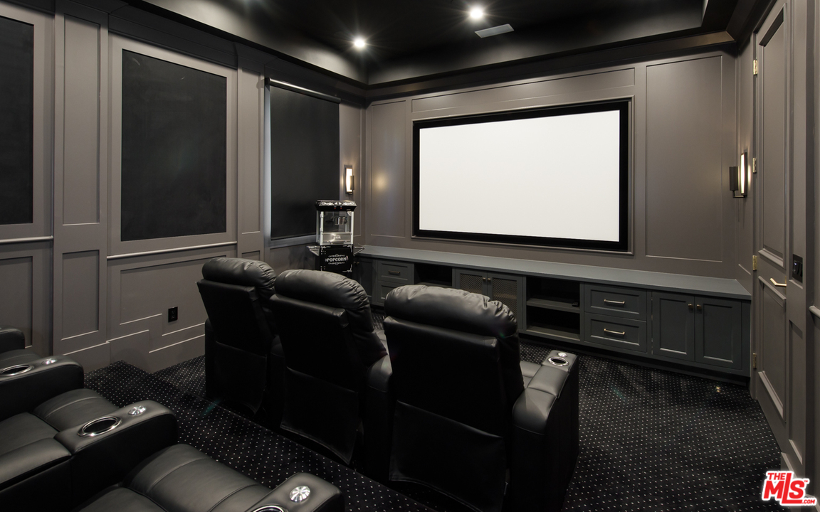 16656 Oldham Street Encino, CA 91436 - Photo 15 of 46 a room with furniture projector and screen
