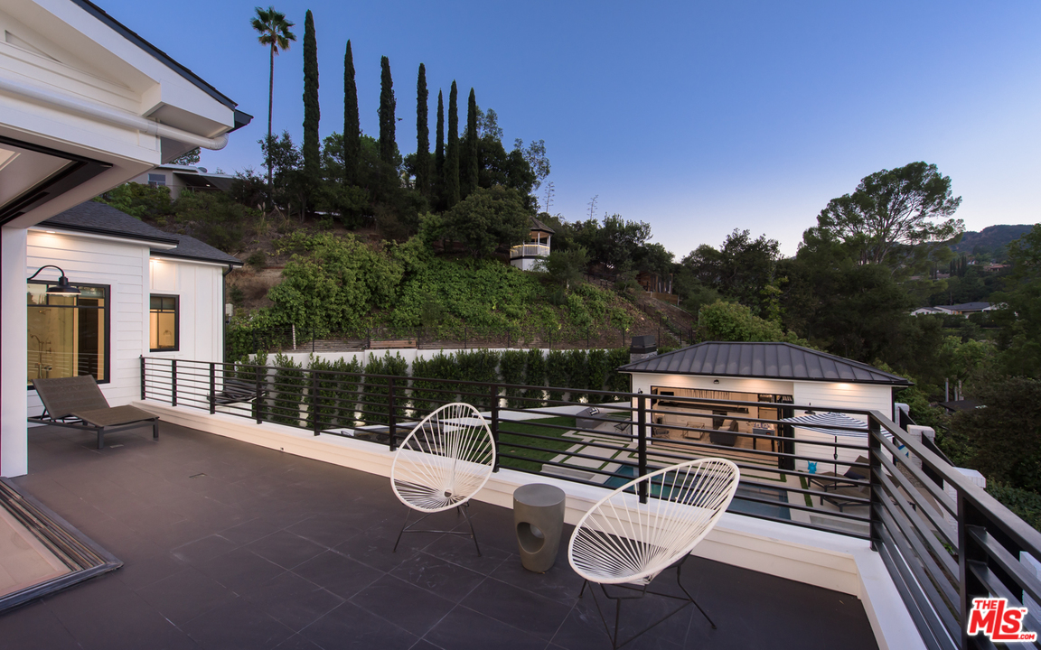 16656 Oldham Street Encino, CA 91436 - Photo 24 of 46 a view of a patio with iron fence