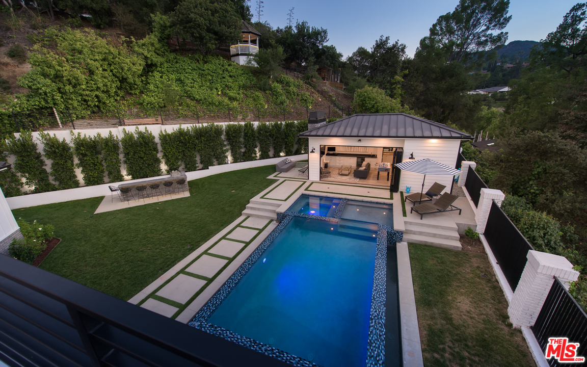 16656 Oldham Street Encino, CA 91436 - Photo 25 of 46 a view of a wooden deck and a yard