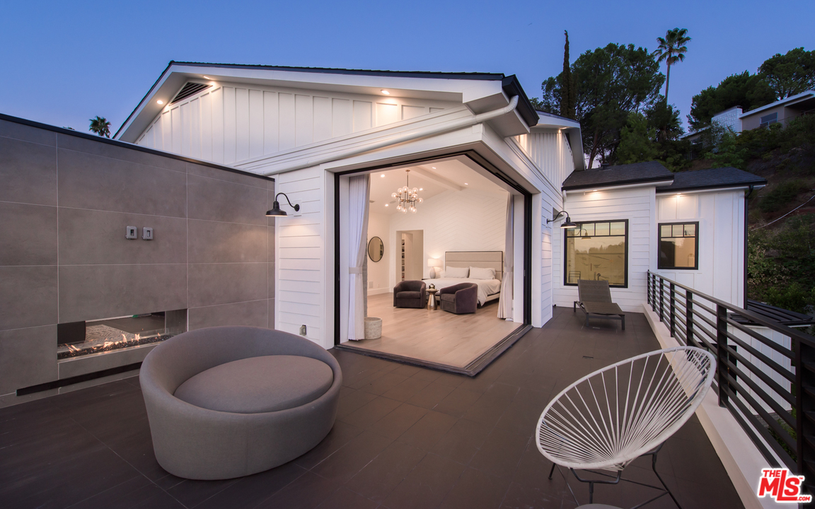 16656 Oldham Street Encino, CA 91436 - Photo 26 of 46 a living room with furniture and a wooden floor