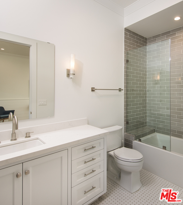 16656 Oldham Street Encino, CA 91436 - Photo 34 of 46 a bathroom with a sink a toilet and shower