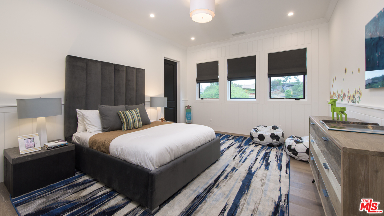 16656 Oldham Street Encino, CA 91436 - Photo 35 of 46 a bedroom with bed and window