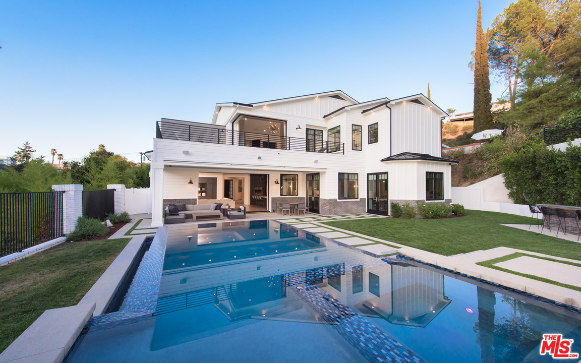 16656 Oldham Street Encino, CA 91436 - Photo 37 of 46 a front view of house with yard having outdoor seating