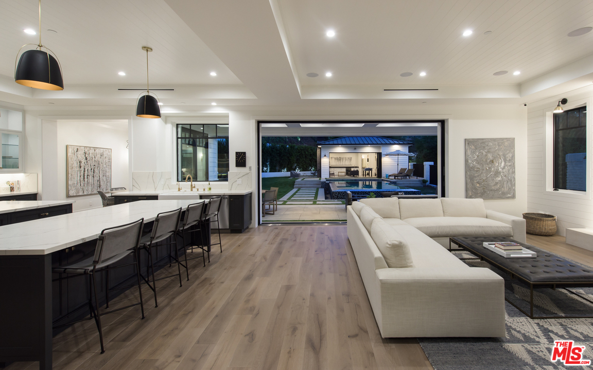 16656 Oldham Street Encino, CA 91436 - Photo 6 of 46 a living room with fireplace furniture and a flat screen tv