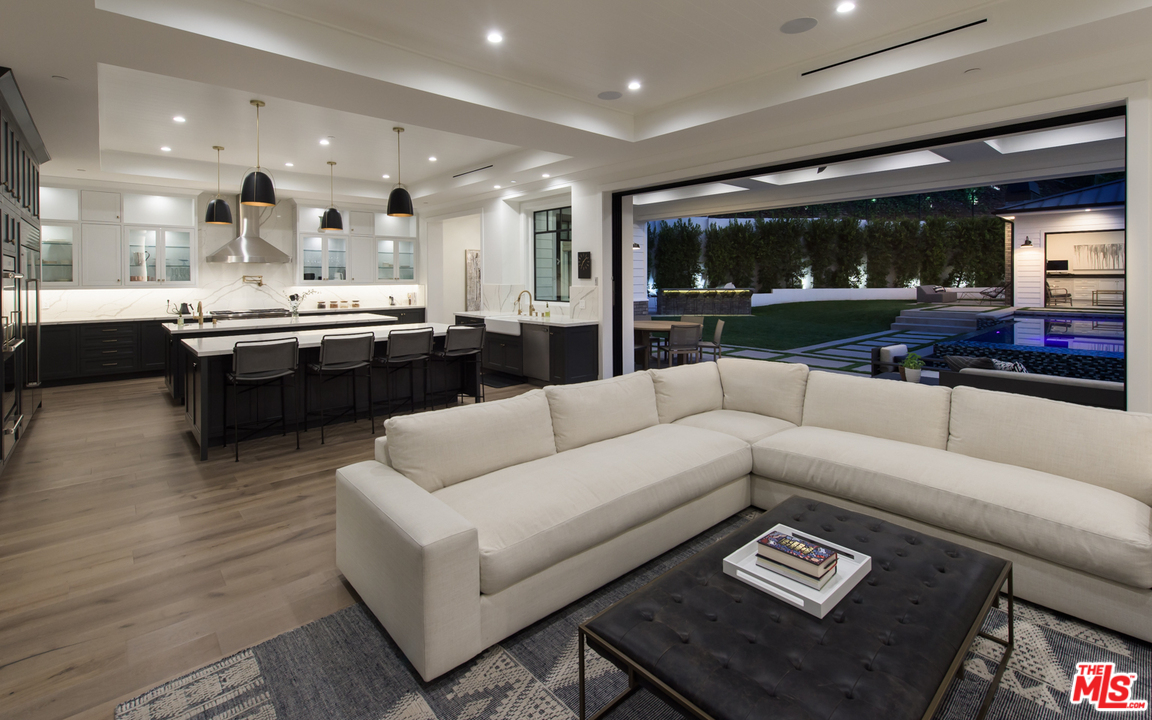 16656 Oldham Street Encino, CA 91436 - Photo 8 of 46 a living room with furniture and a wooden floor