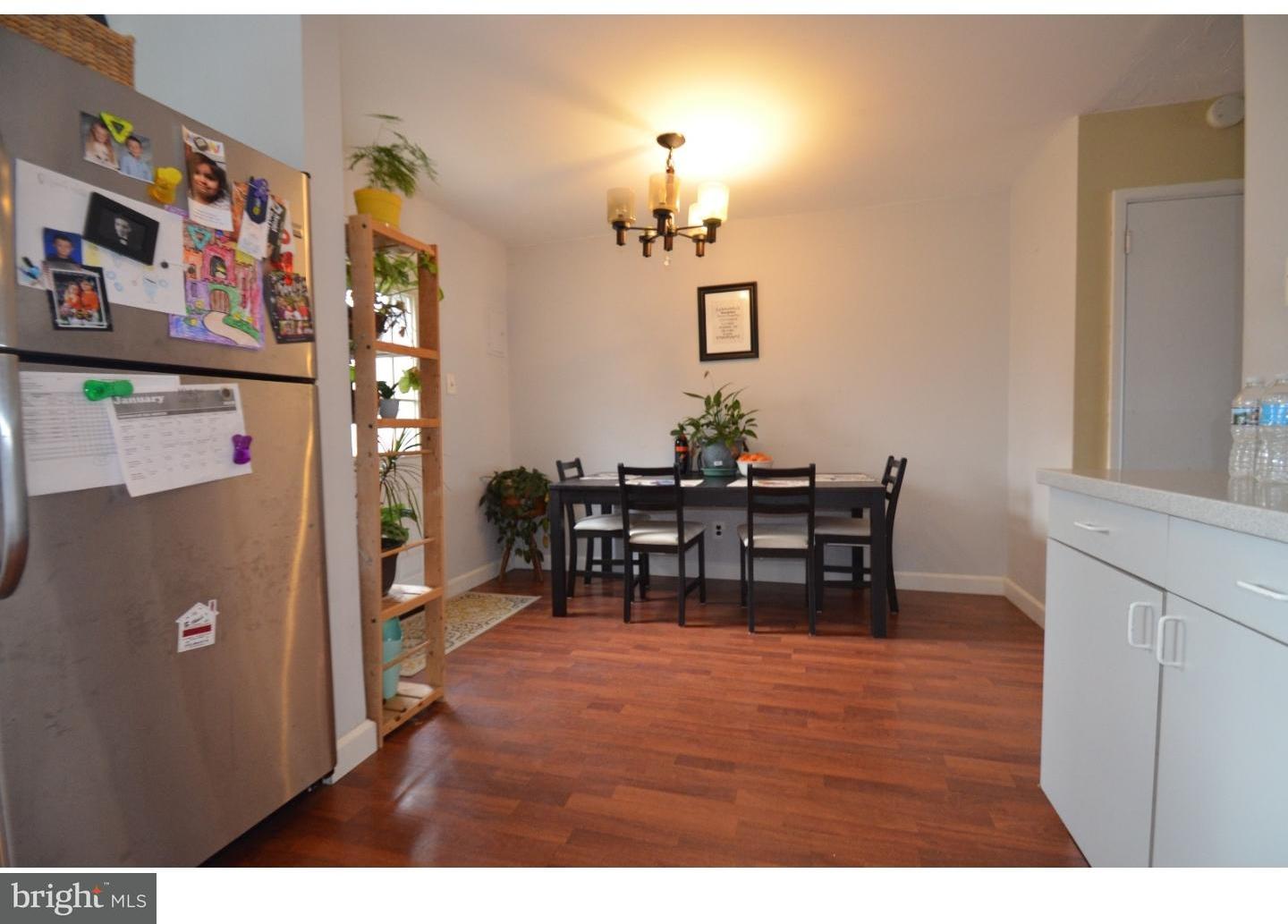 3228 Morning Glory Road Philadelphia, PA 19154 - Photo 3 of 6 a view of a dining room with furniture and chandelier