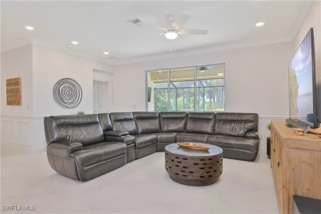 a living room with furniture and a window