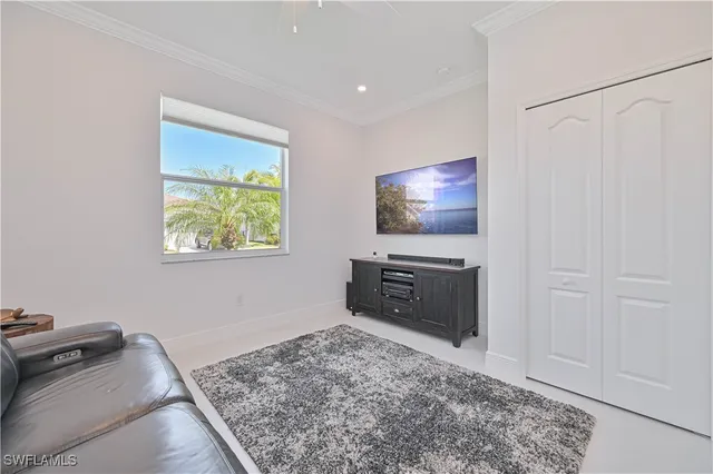 a living room with furniture and a rug
