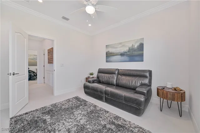 a bedroom with a bed and ceiling fan