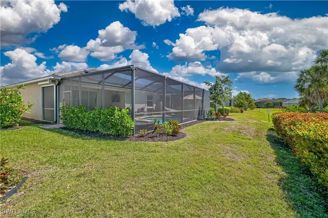 a view of a fountain in front of the house
