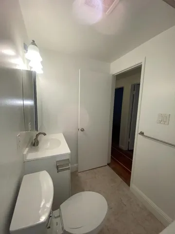 a stove top oven sitting inside of a kitchen