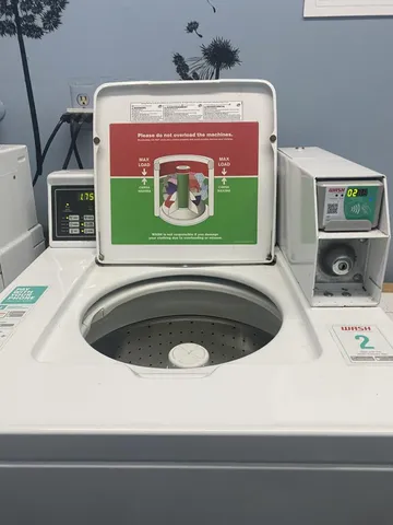 a view of backyard with outdoor seating and stairs