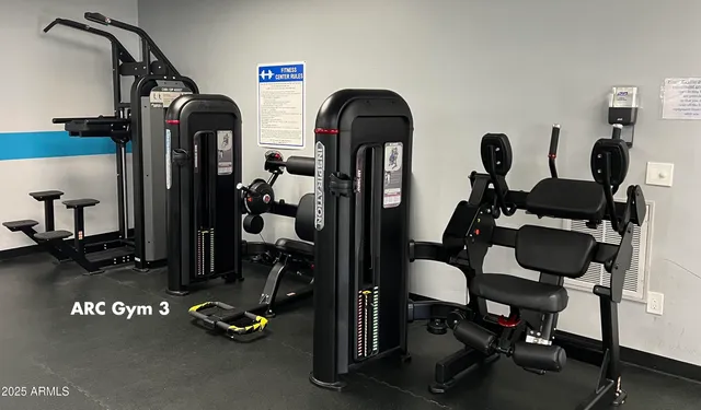 a view of gym equipment and living room