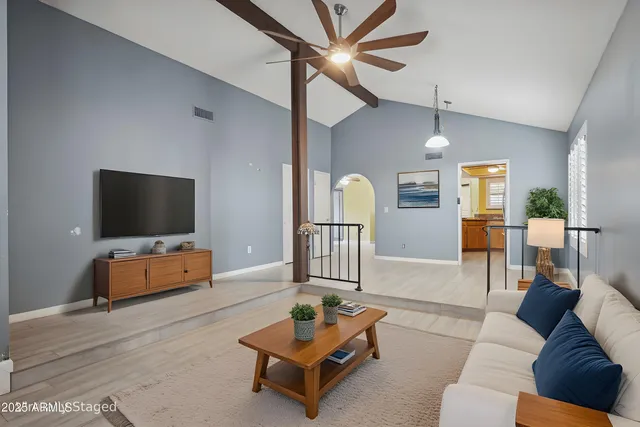 a living room with furniture and a flat screen tv