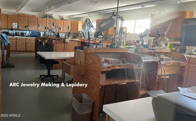 a kitchen with a sink and a stove top oven