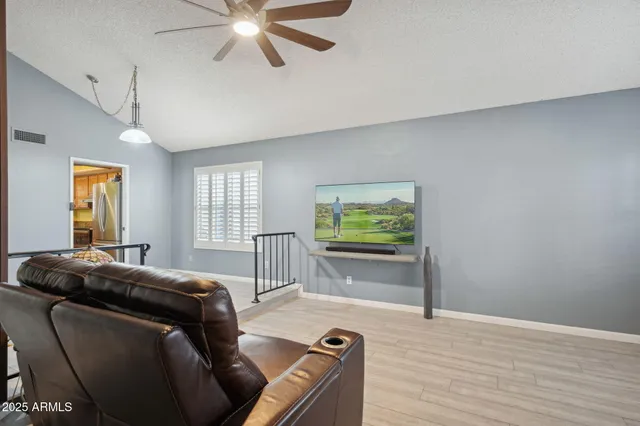 a living room with furniture and a window