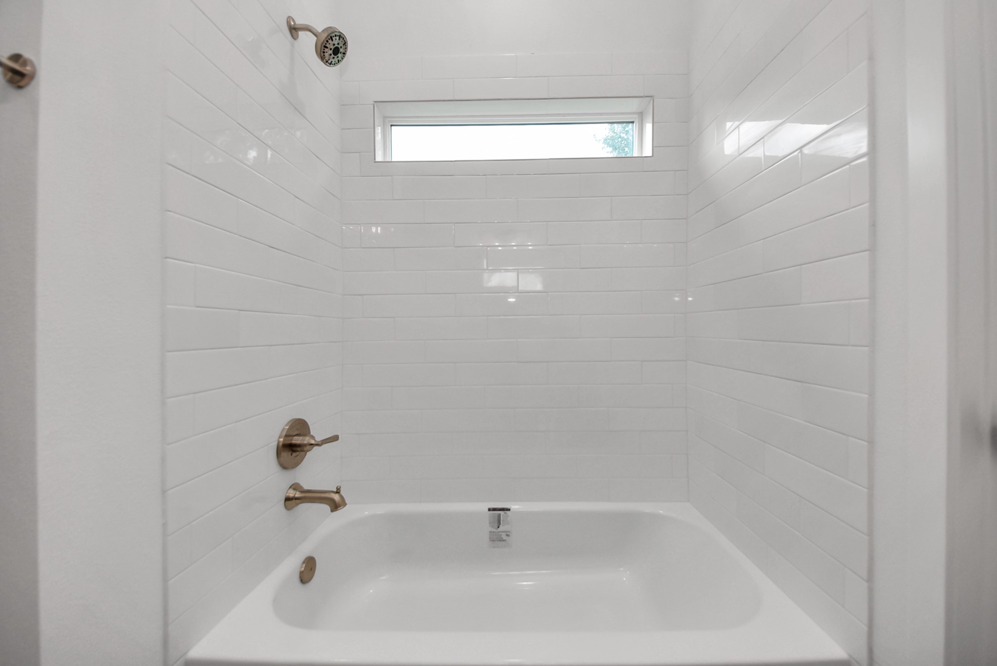 211 19th Street Hempstead, TX 77445 - Photo 22 of 32 Primary bath features tub/shower combination with natural light