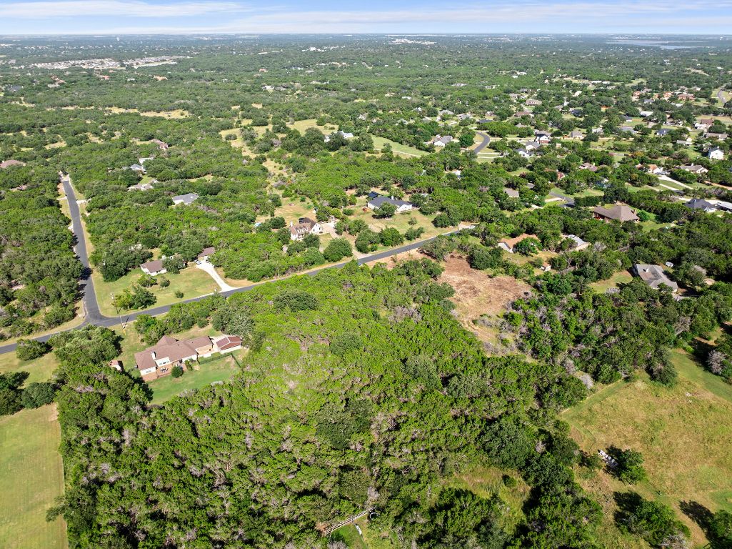 120 Council Road Georgetown, TX 78633 - Photo 8 of 9 an aerial view of residential houses with outdoor space and trees