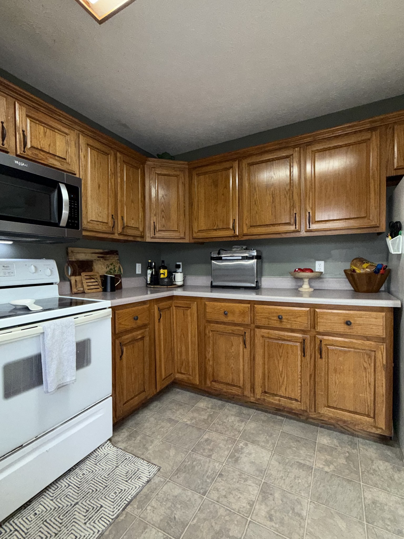 144 B Leo Carter Road Bethpage, TN 37022 - Photo 12 of 34 a kitchen with granite countertop a sink cabinets and stainless steel appliances