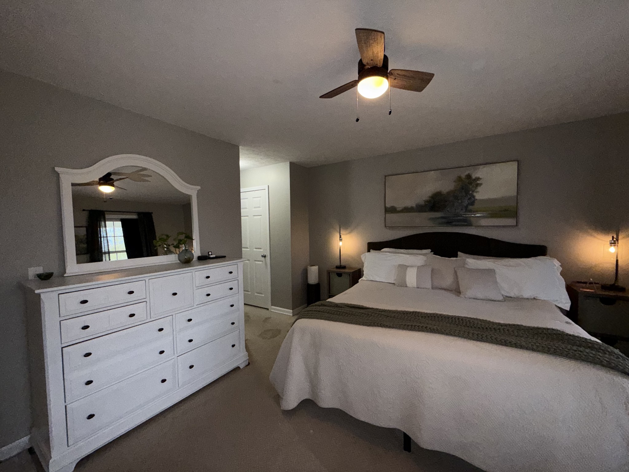 144 B Leo Carter Road Bethpage, TN 37022 - Photo 14 of 34 a bedroom with a large bed and a chandelier