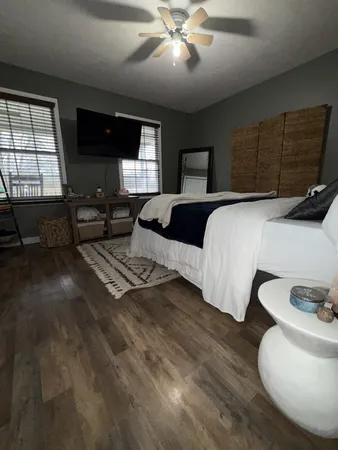 a spacious bedroom with a bed and window