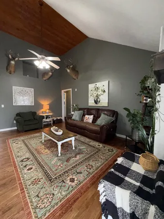 a living room with furniture and a rug