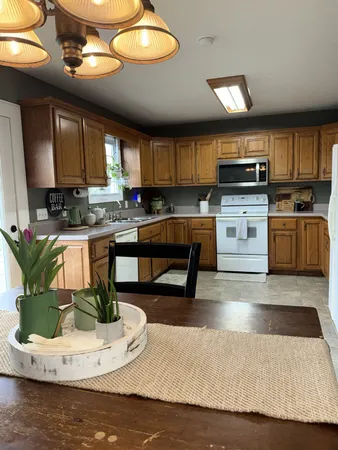 a kitchen with a sink appliances and cabinets