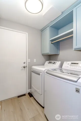 a view of storage and utility room with washer and dryer