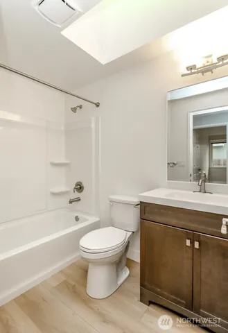 a bathroom with a sink a toilet and a bathtub