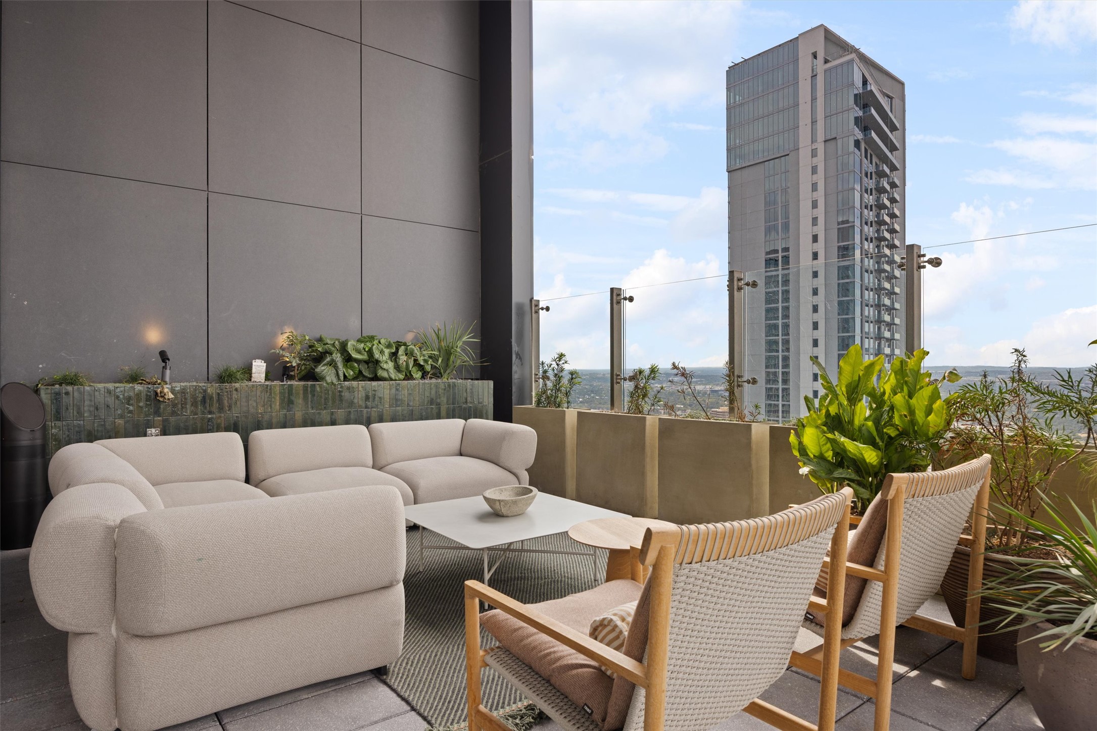 610 Davis Street, Unit 2909 Austin, TX 78701 - Photo 17 of 32 a view of a terrace with couches and potted plants