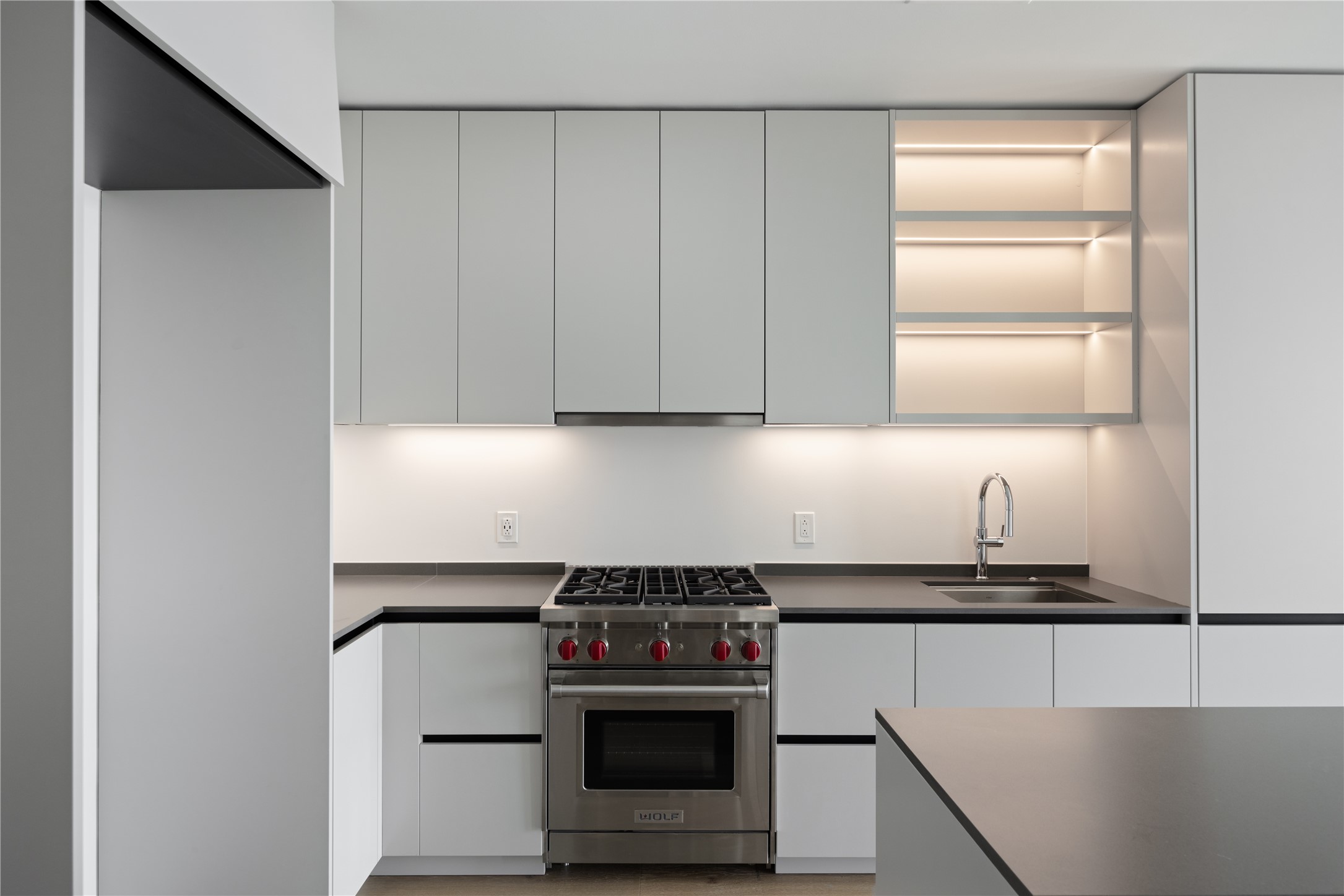 610 Davis Street, Unit 2909 Austin, TX 78701 - Photo 2 of 32 a kitchen with granite countertop a stove and a sink