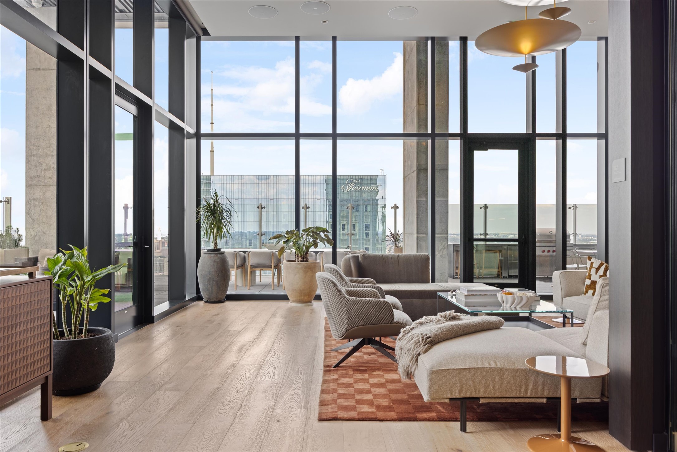 610 Davis Street, Unit 2909 Austin, TX 78701 - Photo 26 of 32 a living room with furniture and a potted plant