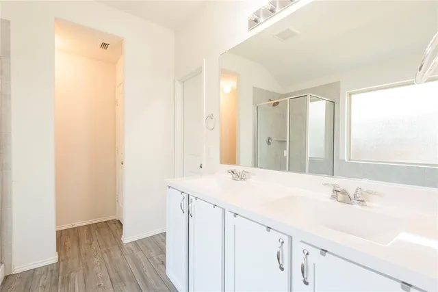 a bathroom with a tub and a shower