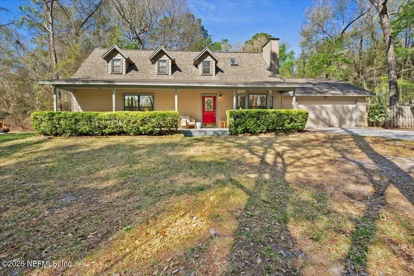front view of a house with a yard