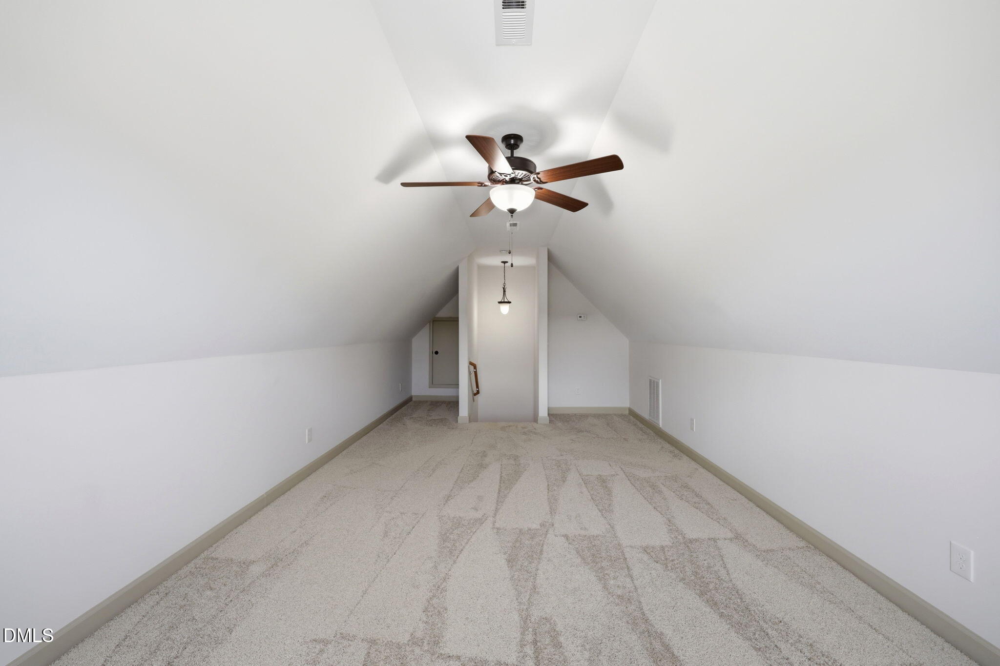 3587 Hannah Creek Road Benson, NC 27504 - Photo 27 of 43 a view of a room with a ceiling fan and a rug